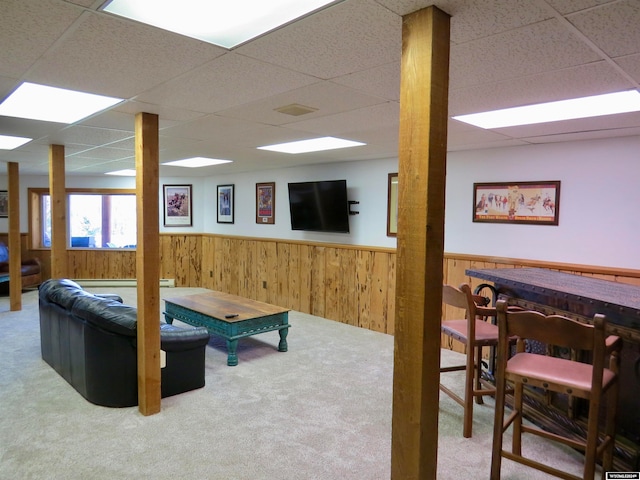 game room featuring light carpet and a paneled ceiling