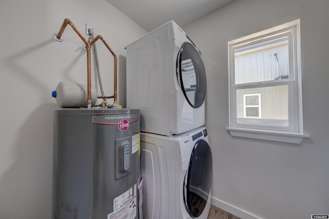 744 E Loucks St, Sheridan, WY 82801 - laundry room featuring stacked washer / dryer and electric water heater