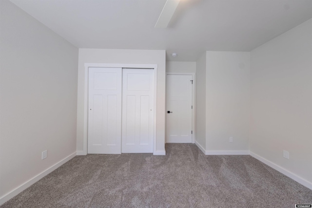 744 E Loucks St, Sheridan, WY 82801 - unfurnished bedroom featuring a closet, ceiling fan, and light carpet
