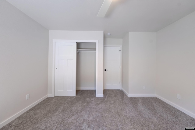 744 E Loucks St, Sheridan, WY 82801 - unfurnished bedroom featuring a closet, ceiling fan, and light carpet