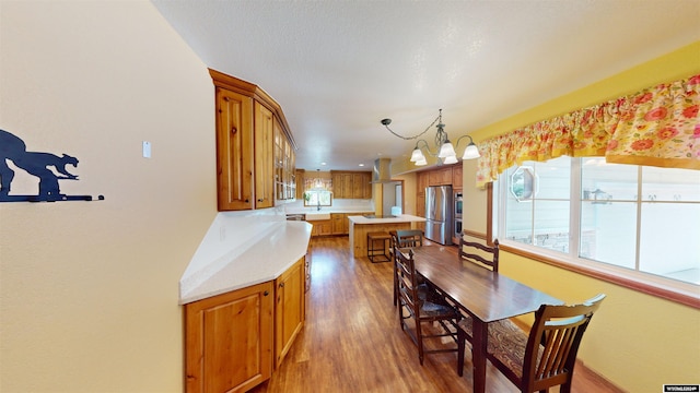 dining area with a notable chandelier and wood-type flooring