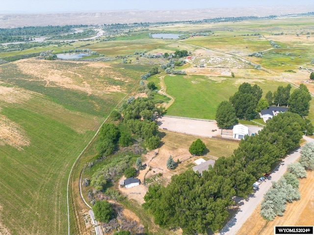 aerial view with a rural view and a water view