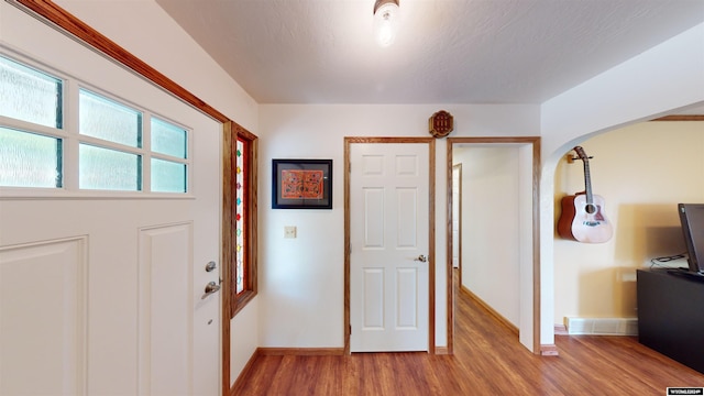 entrance foyer featuring hardwood / wood-style flooring