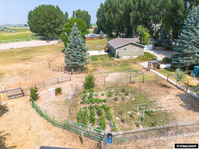 birds eye view of property featuring a rural view