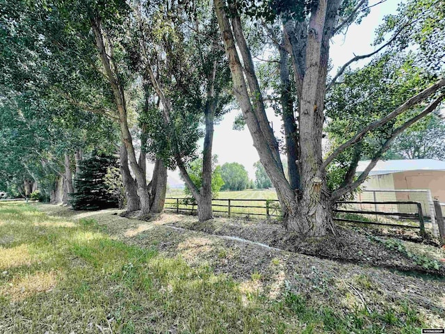 view of yard with a rural view