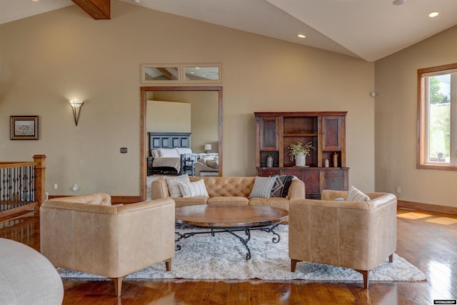 living area with light wood finished floors, beamed ceiling, recessed lighting, and baseboards