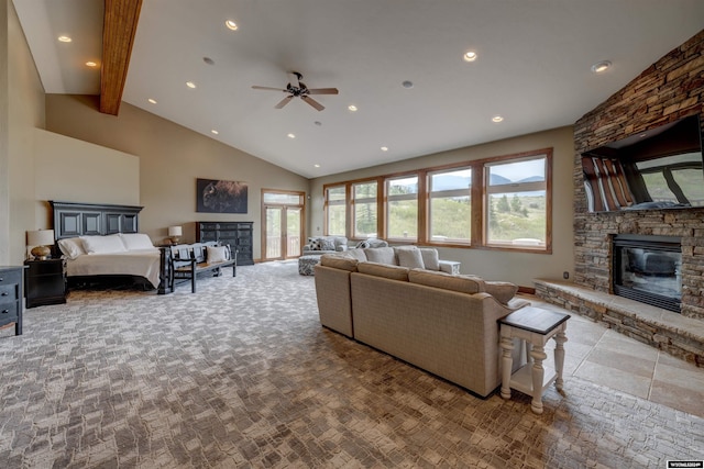 living area featuring high vaulted ceiling, a fireplace, beam ceiling, and a healthy amount of sunlight