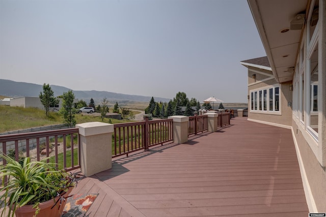 wooden terrace with a mountain view