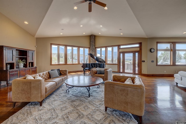 living area with wood finished floors, a wealth of natural light, and baseboards