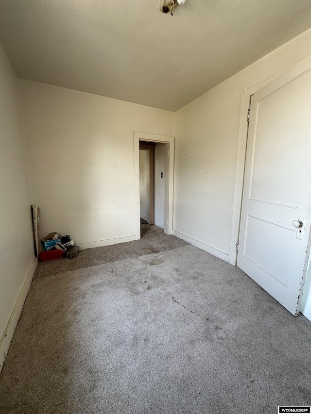 empty room featuring light colored carpet