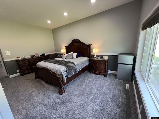 bedroom featuring light carpet