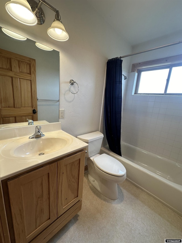 full bath featuring toilet, shower / bath combination with curtain, and vanity