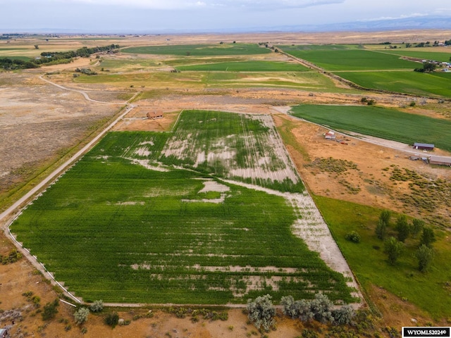 birds eye view of property with a rural view