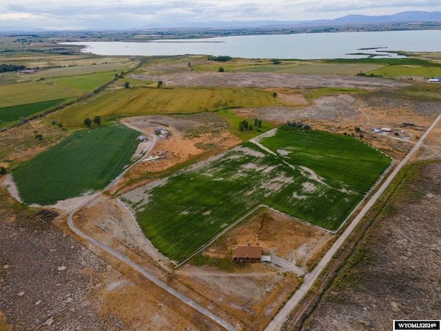 birds eye view of property featuring a rural view and a water view