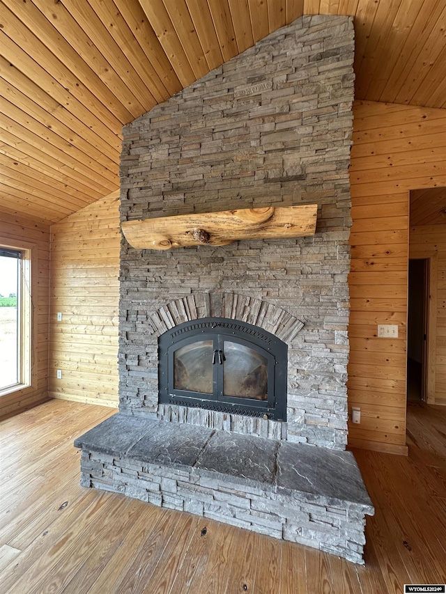 interior details with wooden ceiling, wood finished floors, and wooden walls