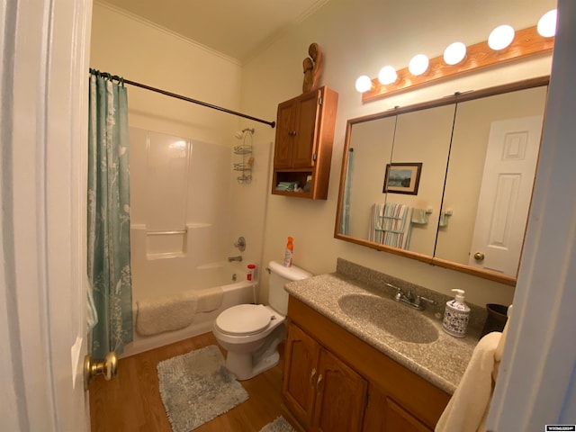 full bathroom featuring crown molding, toilet, vanity, shower / bath combo with shower curtain, and wood-type flooring