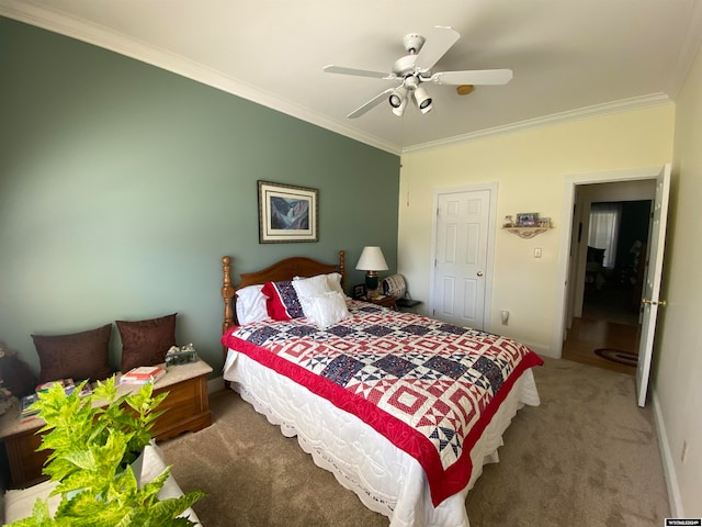 bedroom with carpet, ceiling fan, and crown molding