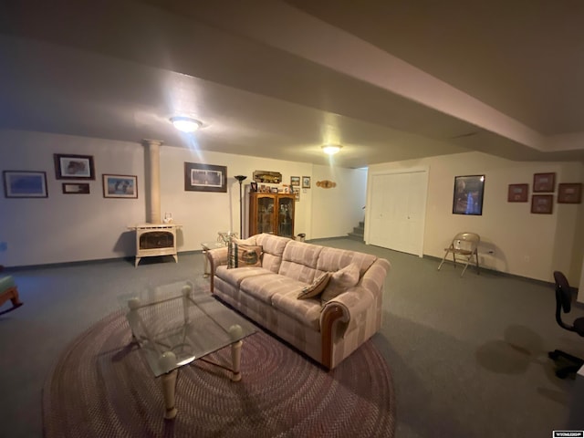 carpeted living room featuring a wood stove