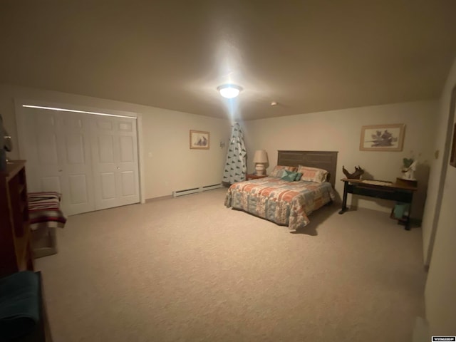 bedroom with carpet, baseboard heating, and a closet