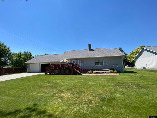 ranch-style house with a front lawn and a wooden deck