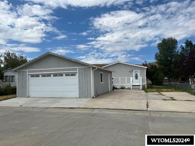 single story home with a garage