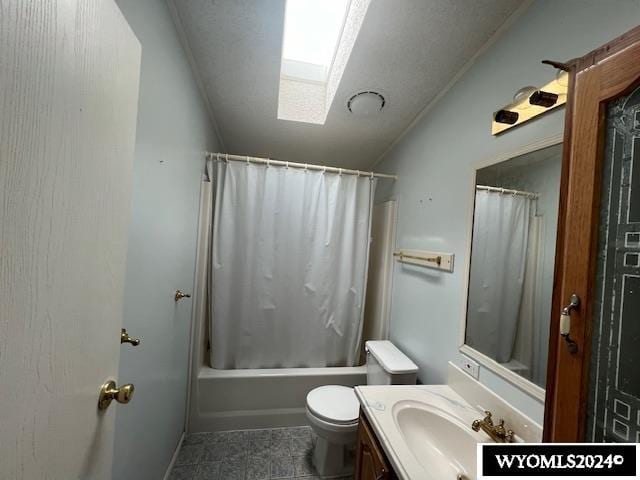 full bath featuring vanity, toilet, lofted ceiling with skylight, and shower / tub combo