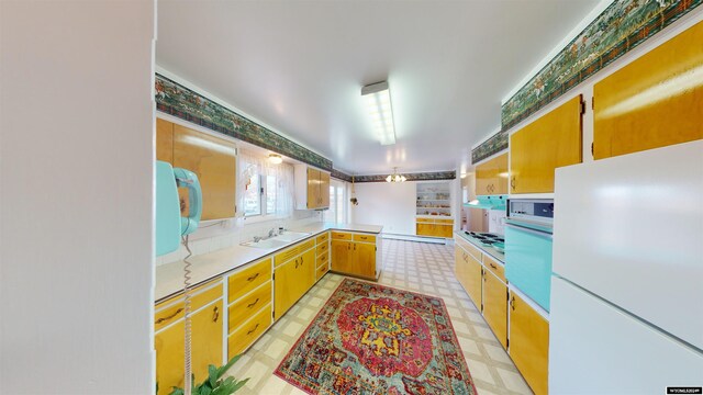 kitchen featuring light tile patterned flooring, white refrigerator, wall oven, sink, and kitchen peninsula