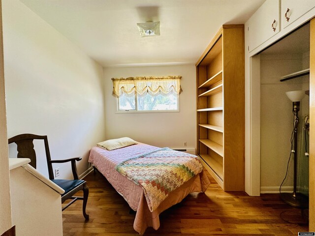 225 S 5th St, Lander, WY 82520 - bedroom featuring baseboards and dark wood finished floors