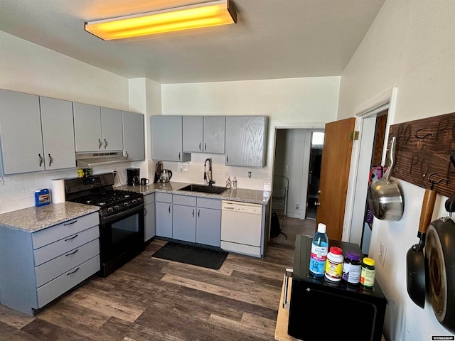 kitchen featuring black range with gas cooktop, dishwasher, dark hardwood / wood-style floors, and sink