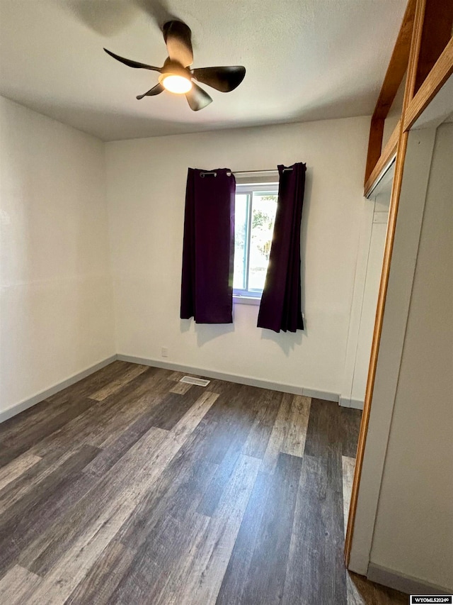 unfurnished room featuring ceiling fan and hardwood / wood-style floors