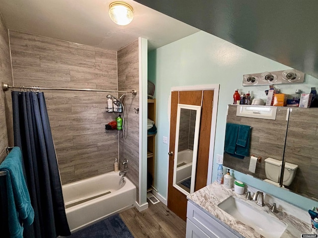 full bathroom featuring vanity, shower / tub combo, wood-type flooring, and toilet