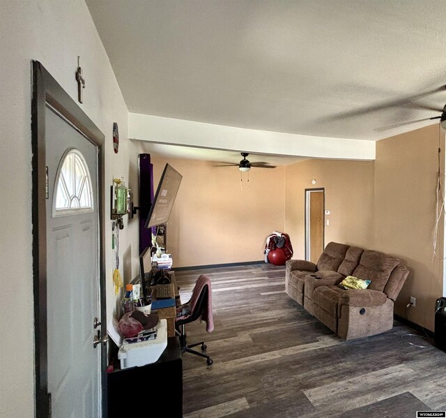 living room featuring wood-type flooring and ceiling fan