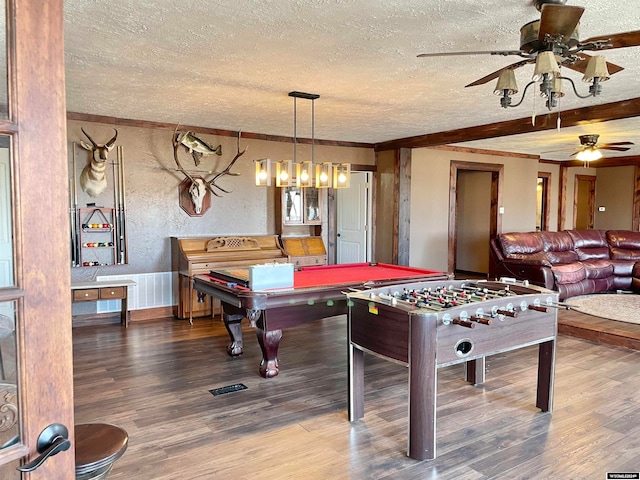 rec room with ceiling fan, a textured ceiling, hardwood / wood-style flooring, and pool table