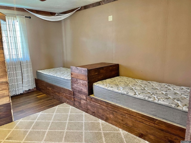 bedroom with wood-type flooring