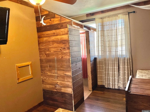 bathroom featuring ceiling fan and wood-type flooring