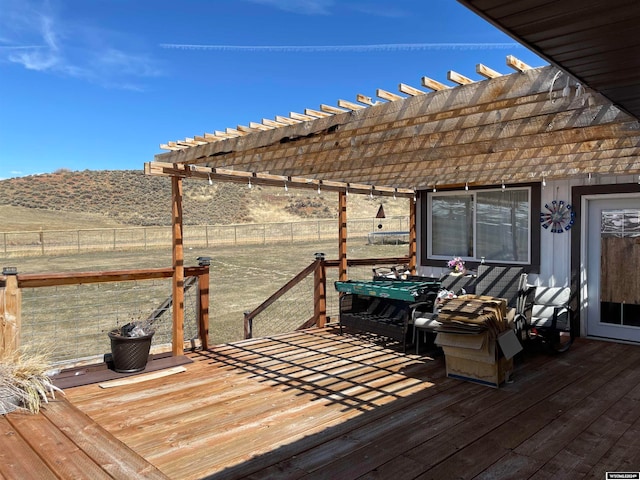 wooden deck with a mountain view and a pergola