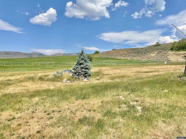 view of mountain feature with a rural view