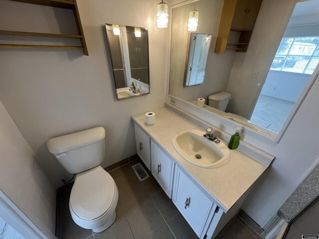 309 S Cherry, Pavillion, WY 82523 - bathroom with vanity, tile patterned floors, and toilet
