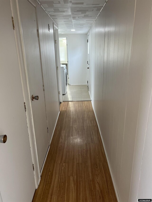309 S Cherry, Pavillion, WY 82523 - hall with washing machine and clothes dryer and wood-type flooring