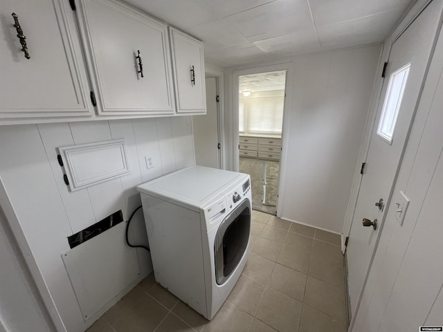 309 S Cherry, Pavillion, WY 82523 - washroom with washer / clothes dryer, light tile patterned flooring, and cabinets