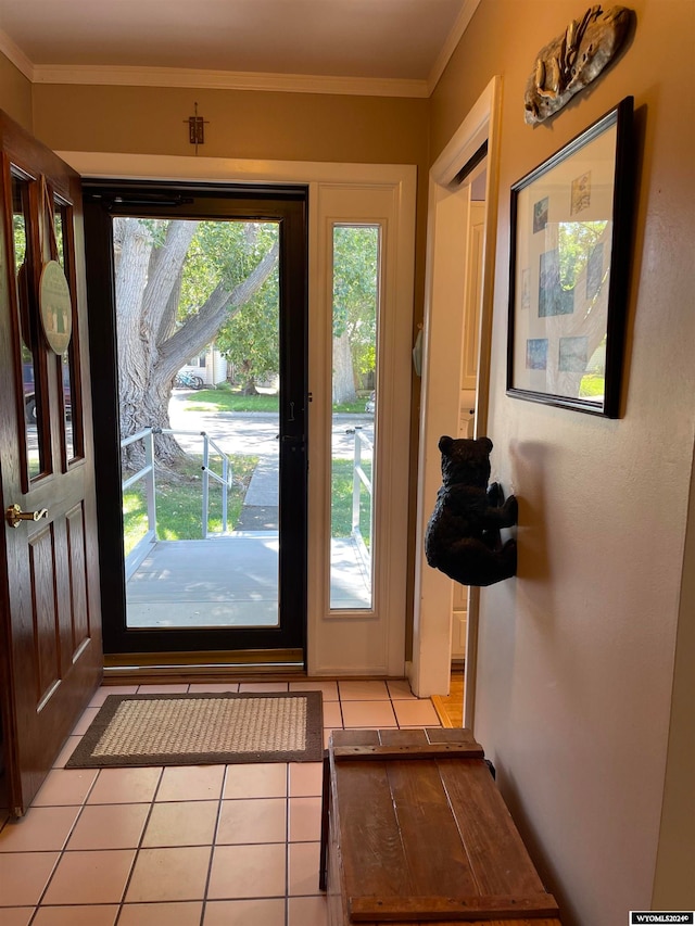 doorway featuring light tile patterned flooring and crown molding