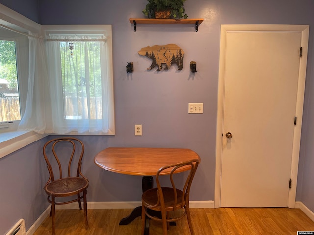 dining space featuring light wood-type flooring