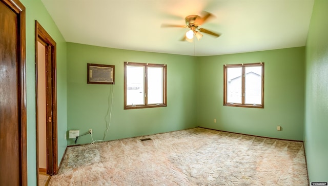 spare room with light carpet and ceiling fan