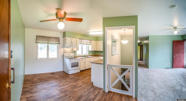 kitchen with ceiling fan, dark carpet, white electric range oven, and white cabinetry