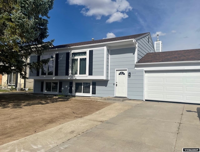 raised ranch featuring a garage