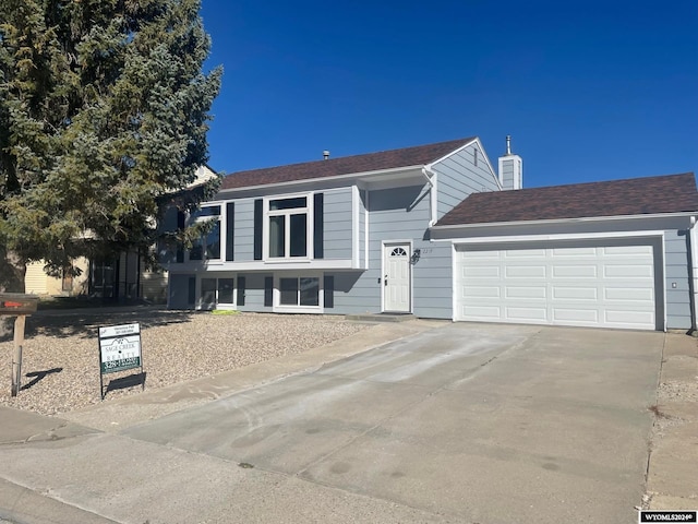 raised ranch featuring a garage