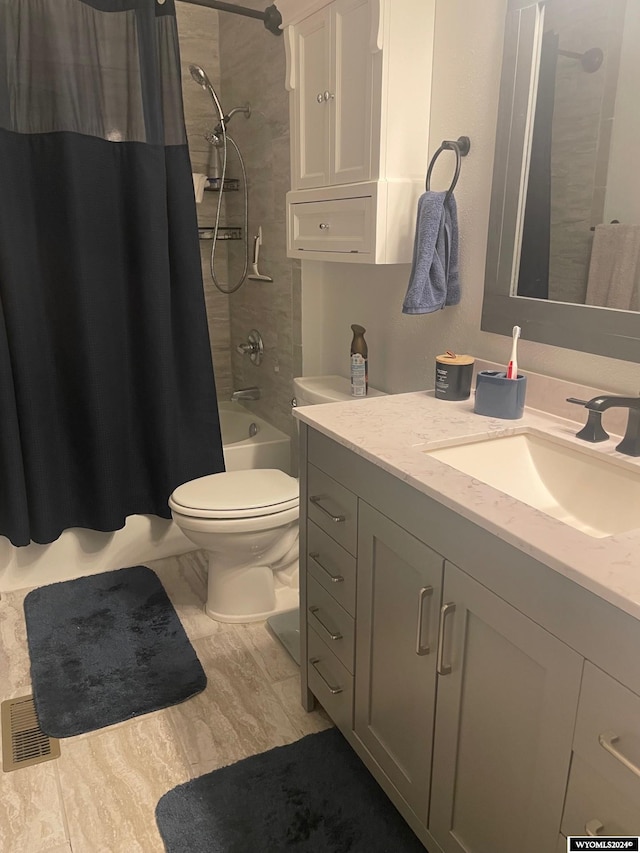 full bathroom featuring shower / tub combo with curtain, vanity, and toilet