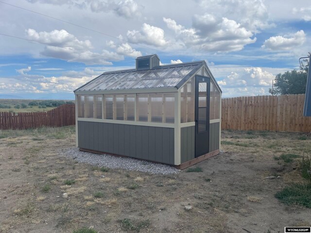 back of property with a wooden deck