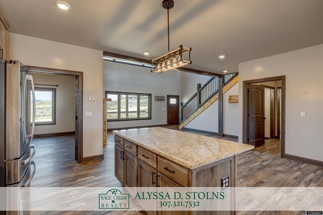 living room with hardwood / wood-style flooring and high vaulted ceiling