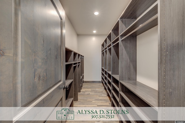 spacious closet featuring wood finished floors